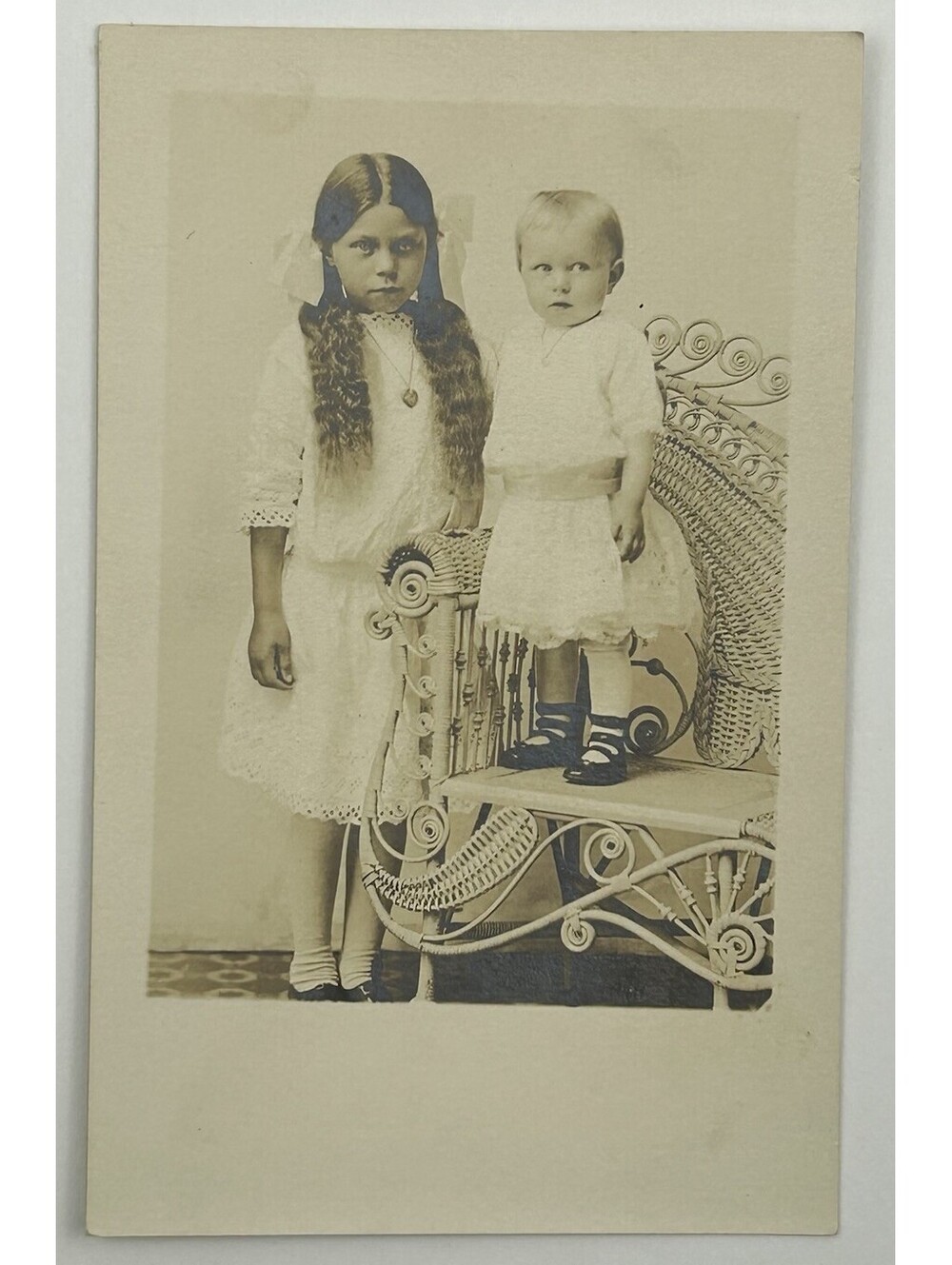 Antique c1910s AZO RPPC Postcard Children Wicker Chair Studio Portrait Photo E12